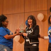 Image of President Mantella being presented with a gift by TRIO advisors for speaking at event